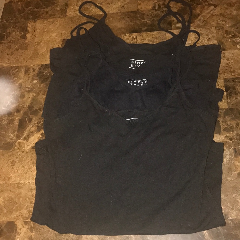 Four black tank tops